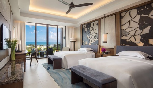 Habitación ejecutiva con 2 camas individuales, vistas parciales al mar