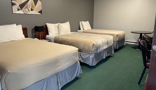 Habitación triple Deluxe, varias camas