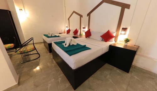 Habitación triple familiar, vistas al jardín