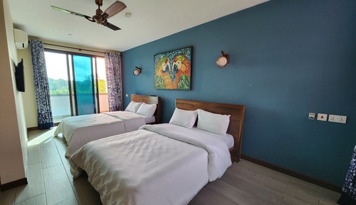 Habitación Deluxe con 2 camas individuales, 2 camas dobles, vistas al jardín, en la zona del jardín