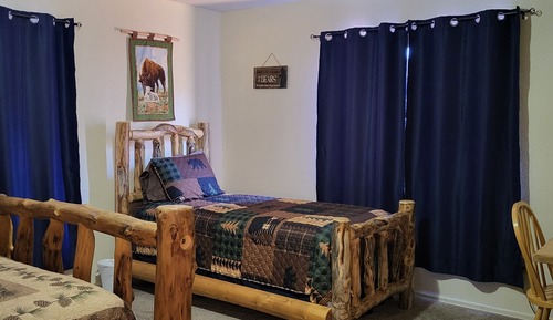 Habitación, varias camas