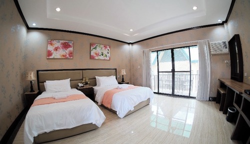 Habitación triple Deluxe, varias camas