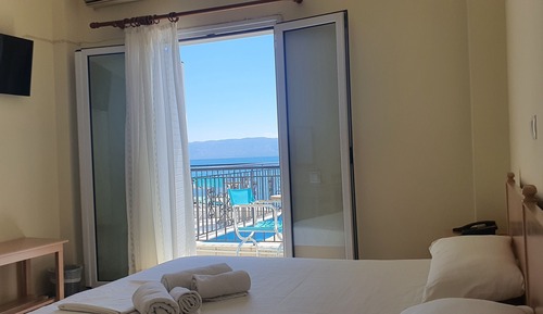 Habitación triple, vistas al mar