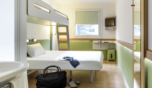 Habitación triple, varias camas