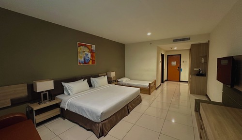 Habitación triple Deluxe, varias camas