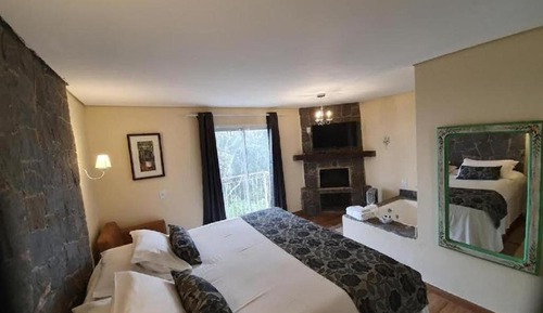 Chalet superior, chimenea (Banheira de Hidromassagem)