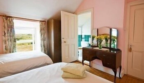Habitación triple, vistas al mar