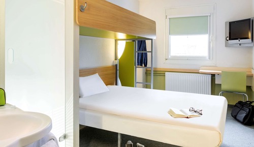 Habitación triple, varias camas