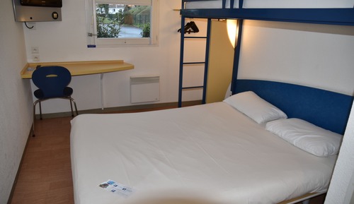 Habitación triple, varias camas
