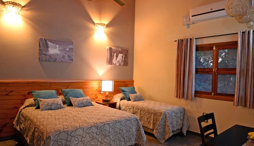 Habitación triple Deluxe, 1 habitación, patio, vistas al jardín