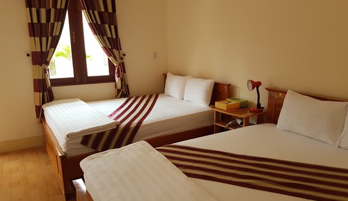 Habitación cuádruple Deluxe, 2 camas de matrimonio, no fumadores, vistas al jardín