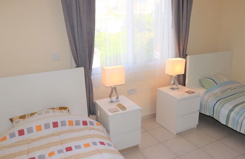 Peyia Town Casa | Direct access to the pool from the garden. A sandy beach is a few minutes away.
