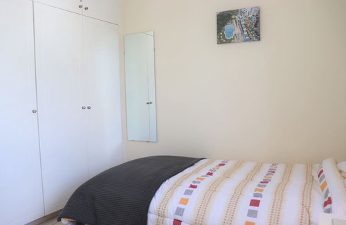 Peyia Town Casa | Direct access to the pool from the garden. A sandy beach is a few minutes away.