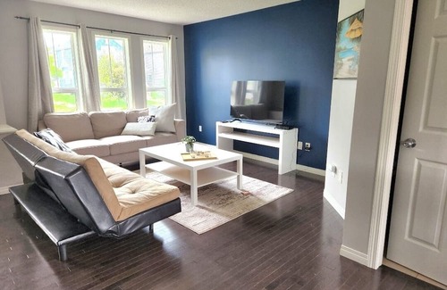 Southeast Edmonton Casa | House in Summerside with a huge patio and an extra tall garage