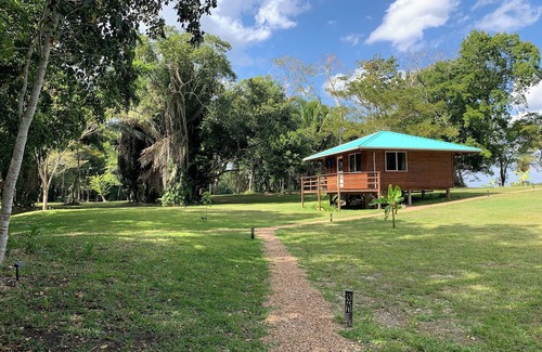 Orange Walk District Cabina | A Cozy cabin along the Rio Bravo River—bird watcher’s paradise with WiFi and AC.