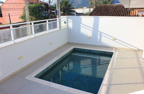 Centro Condominio | Comfort in Peruibe - Gated community and swimming pool