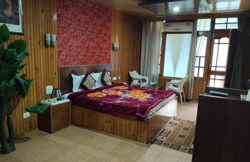 Chachian Hotel | Goroomgo The Woodz Dharamsala