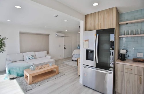 Huntington Harbour Cabaña | STEPS TO PRIVATE BEACH FRONT PANORAMIC OCEAN VIEWS! Home - parking lot - sand.