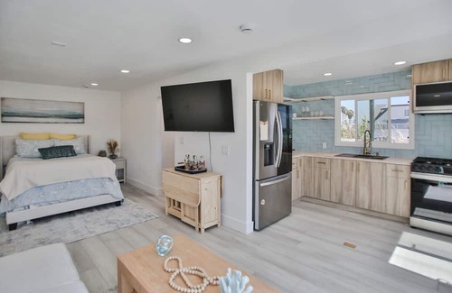 Huntington Harbour Cabaña | STEPS TO PRIVATE BEACH FRONT PANORAMIC OCEAN VIEWS! Home - parking lot - sand.