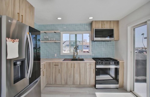 Huntington Harbour Cabaña | STEPS TO PRIVATE BEACH FRONT PANORAMIC OCEAN VIEWS! Home - parking lot - sand.