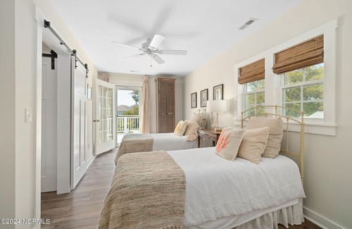 Cedar Point Casa | Luxury at the Water, enjoy the bikes, kayaks, volleyball, and shared dock that is a short walk away.
