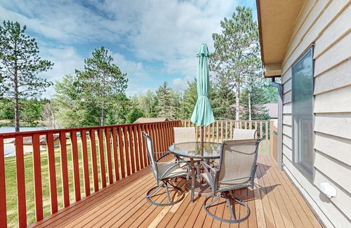 Hazelhurst Casa | Lakefront home with large patio, fire pit, air hockey & a provided peddle boat
