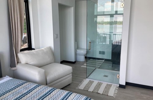 Delton Casa | MODERN & NEW Lake Home w/swimmable beach and built in entertainment