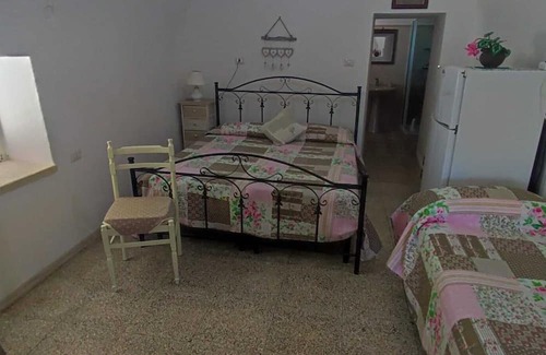 Posto Vecchio Apartamento | Apartment 'Trullo' with Private Terrace, Private Garden and Air Conditioning