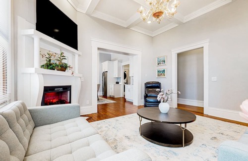 Metropolitan Casa | Dog-friendly duplex with front porch, fenced yard & walkable location