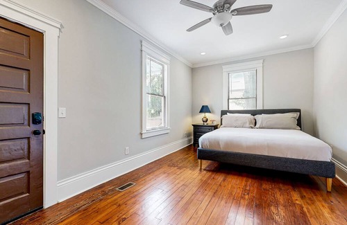 Metropolitan Casa | Dog-friendly duplex with front porch, fenced yard & walkable location