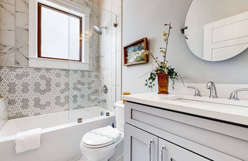 Metropolitan Casa | Dog-friendly duplex with front porch, fenced yard & walkable location