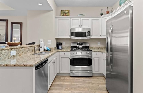 Windy Hill Casa | Aqua Escape: Oceanfront 2BR Condo with King & Queen Beds