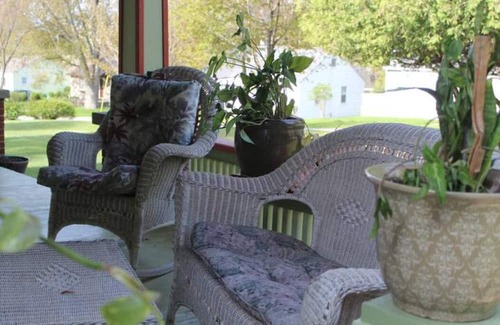 Onekama Apartamento | Relax on deck next to the pool in this two room suite.