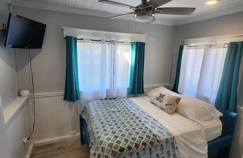 Indian River Estates Cabaña | Cozy Waterfront Cottage w/ hot tub, dock & tiki