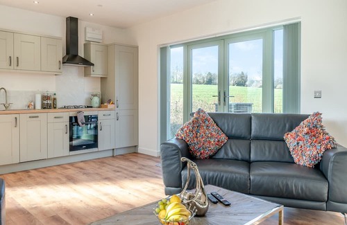 Coed-Y-Paen Cabaña | Fox Acre is a stunning lodge with views over the rolling hills, perfect for a relaxing break away or