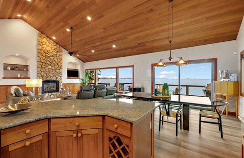 Sandpoint Casa | Waterfront home with private dock, beach, hot tub & wrap-around deck