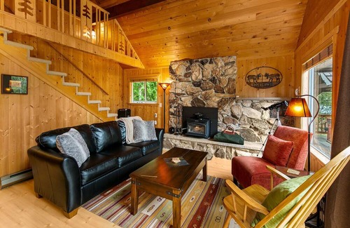 Baring Cabina | Delightful river front cabin with new hot tub and mountain views.