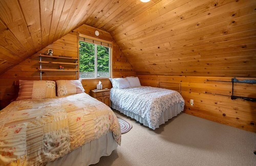 Baring Cabina | Delightful river front cabin with new hot tub and mountain views.