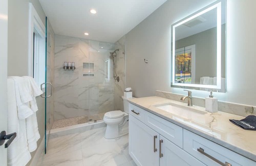 Sparta Township Casa | Aspen-style lakefront retreat house with hot tub, game room