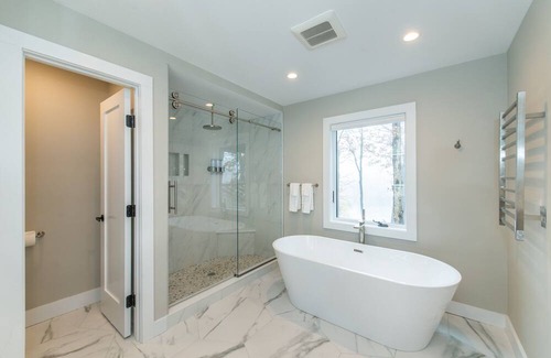 Sparta Township Casa | Aspen-style lakefront retreat house with hot tub, game room
