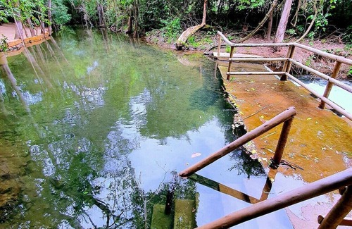 Pousada do Rio Quente Apartamento | Resort Park Veredas with the warm river in the background