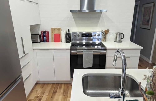 Verdun Condominio | Cozy, modern, house-like condo, big backyard, sunny deck, space for 2 cars