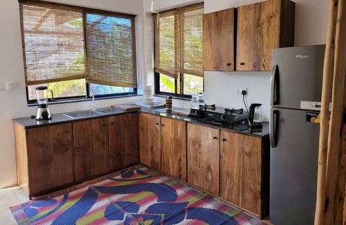 Bwejuu Beach Apartamento | SAND BEACH PALM RESIDENCE