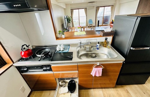 Mihokan Onsen Apartamento | A panoramic view of Lake ShinjiSpacious living s / Matsue Shimane
