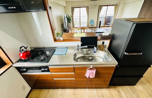 Mihokan Onsen Apartamento | A panoramic view of Lake ShinjiSpacious living s / Matsue Shimane