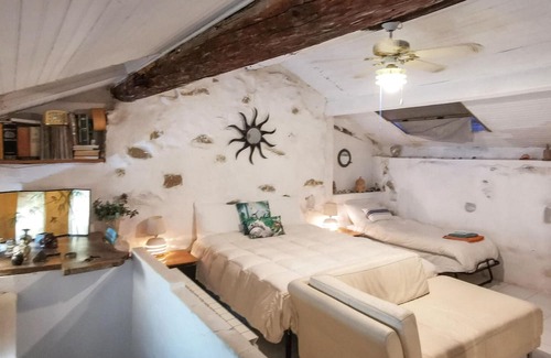 Latte Apartamento | With a fantastic view of the sea and the coast, this cozy vacation apartment welcomes you to a green