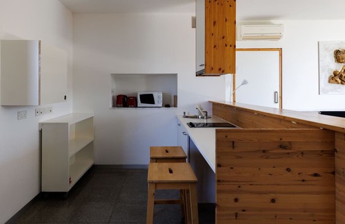 Pentakomo Apartamento | Eunoia | One-Bedroom Apartment, Art by PraXis Apartments