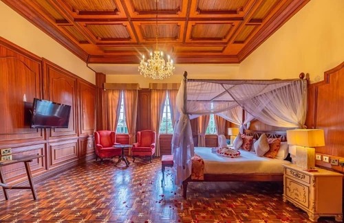 Limuru Hotel | Scenic Escape: Elegant Room Overlooking Lush Grounds