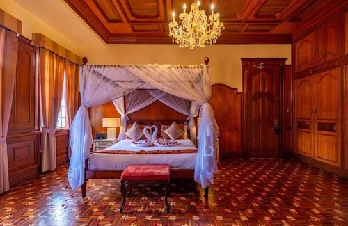Limuru Hotel | Scenic Escape: Elegant Room Overlooking Lush Grounds