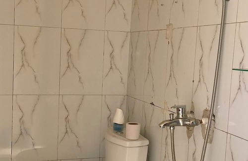 Limete Casa | Cozy Guest Room in Kinshasa with Balcony and Partial Air-Conditioning
